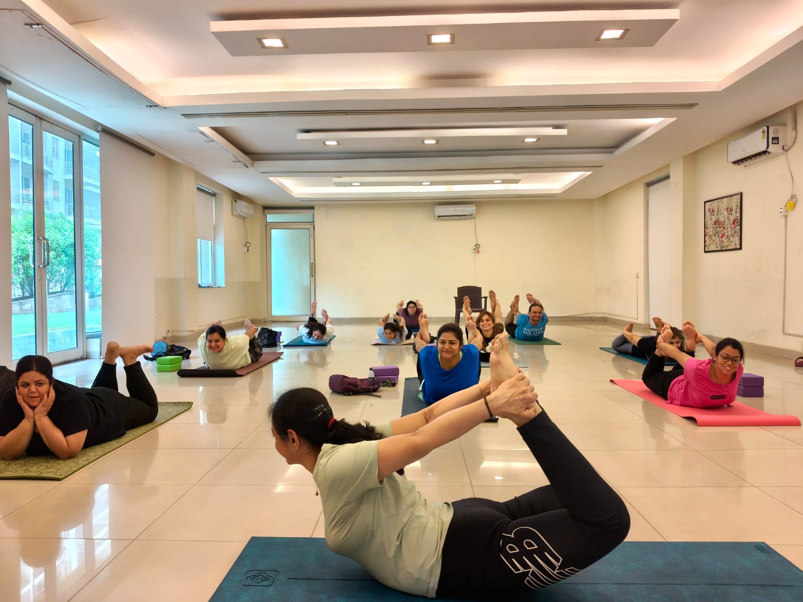 Group yoga class with Sneha